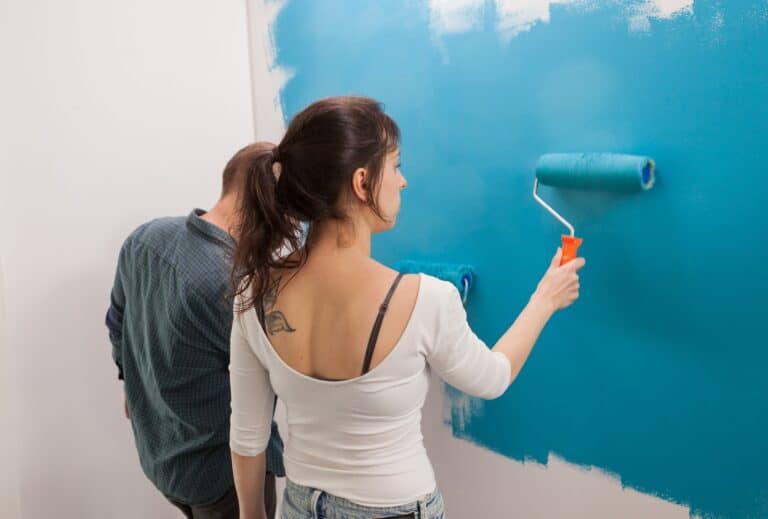 woman painting wall 768x519 1